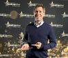Bertrand Bodson holding a develop Star Award